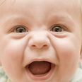 Smiling baby boy closeup portrait with soft focus