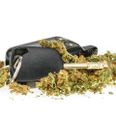 Driving high, marijuana and car key isolated on white