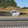 En bil gik i brand efter et frontalt sammenstød. Foto: Presse-fotos.dk.