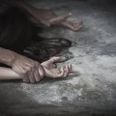 Man's hand holding a woman hand for rape and sexual abuse concept, anti-trafficking and stopping violence against women, International Women's Day