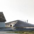 Velkomstcentret som det er blevet præsenteret af arkitektfirmaet Arkitema. Velkomstcentret placeres langs det eksisterende strandhus, der skal fungere som administrationsbygning.